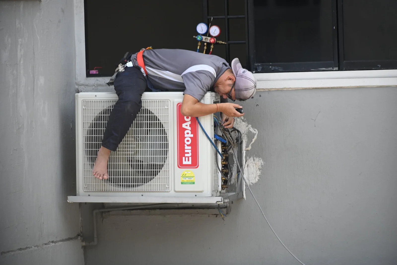 Technician inspecting a furnace in early fall